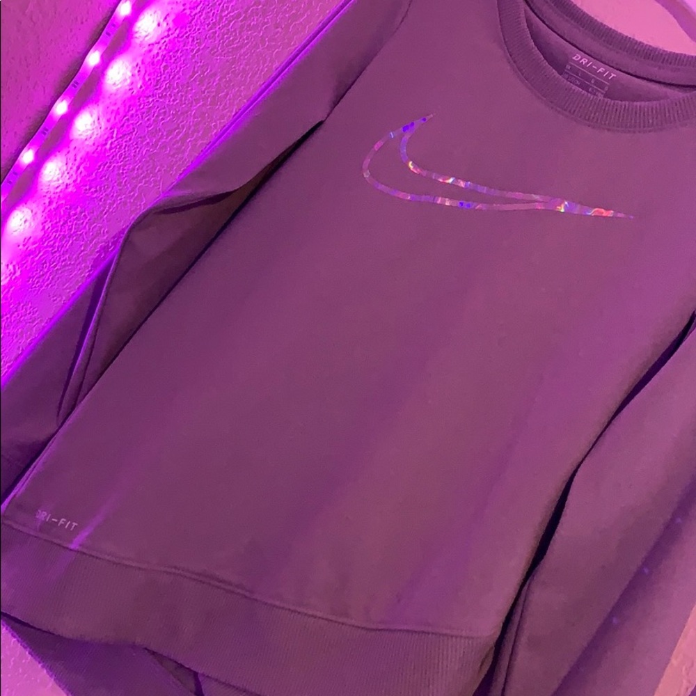 Gray Nike sweatshirt with holographic Nike symbol